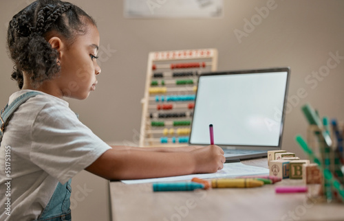 Girl writing, education toys and laptop in house with crayons, paper and mental development by desk. Young african child, female learner or pen for notes, drawing or learning in home school with pc
