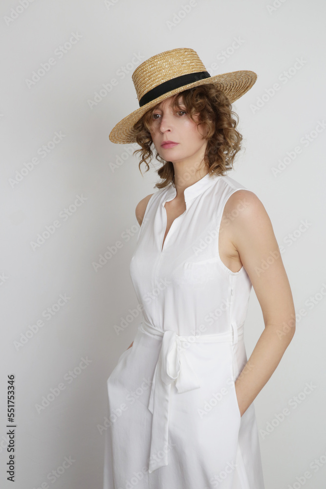 Series of studio photos of young female model in white midi dress Series of studio photos of young female model in white midi dress