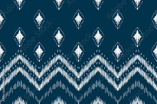 Ethnic ikat seamless pattern in tribal. Aztec geometric ethnic ornament print. Ikat pattern style. Design for background, wallpaper, illustration, fabric, clothing, carpet, textile, batik, embroidery.
