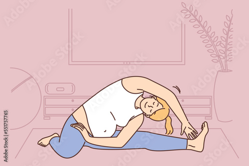 Pregnant woman practice yoga at home 