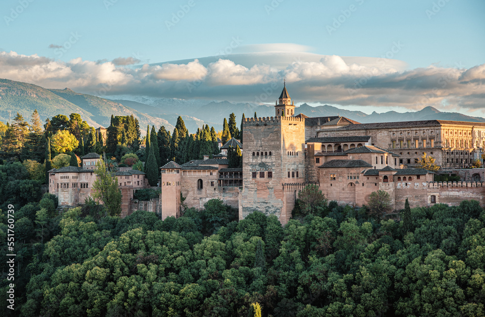Alhambra the arabic castle in Granada, Andalucia, Spain - Sierra Nevada mountains in background. Seen from plaza de San Nicolas Albaycin