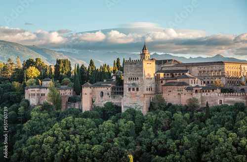 Alhambra the arabic castle in Granada, Andalucia, Spain - Sierra Nevada mountains in background. Seen from plaza de San Nicolas Albaycin photo