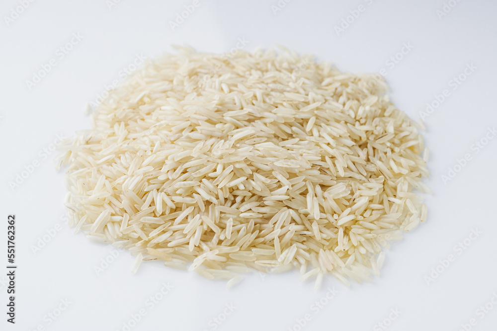 raw basmati rice on a white acrylic background