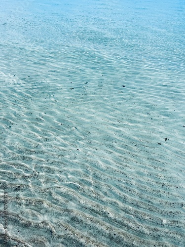Transparent sea surface. seashore, natural sea water texture background