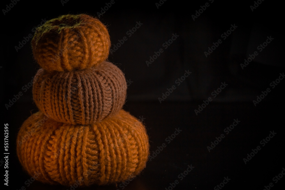 Yellow-orange pumpkins on a black background the concept of Halloween and the autumn harvest of pumpkin close-up copyspace from above Yellow-orange pumpkins on a black background the concept of Halloween and the autumn harvest of pumpkin close-up copyspace from above