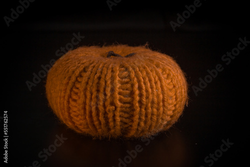 Yellow-orange pumpkins on a black background the concept of Halloween and the autumn harvest of pumpkin close-up copyspace from above
