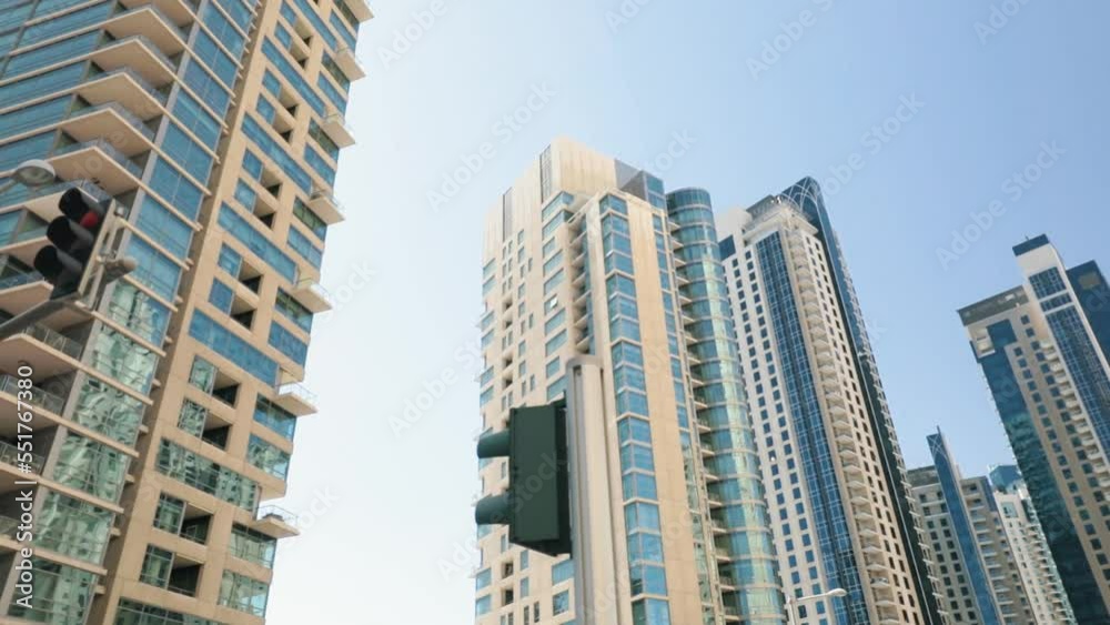 Look Up At Modern Skyscrapers In Dubai, From a Moving Car, Slowmotion Look Up At Modern Skyscrapers In Dubai, From a Moving Car, Slowmotion