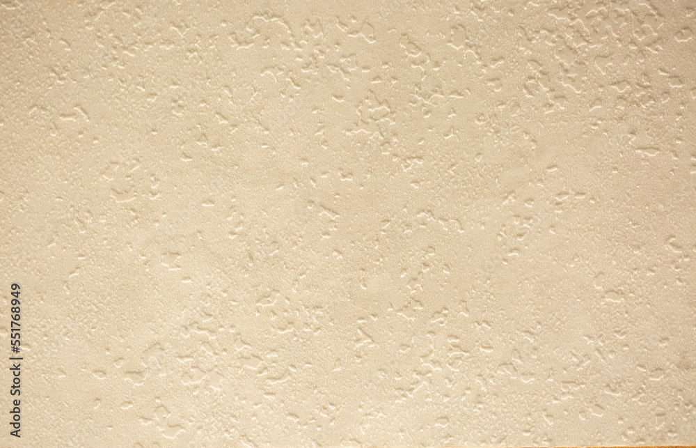 Brown background from decorative plaster with abstract spots. Unusual