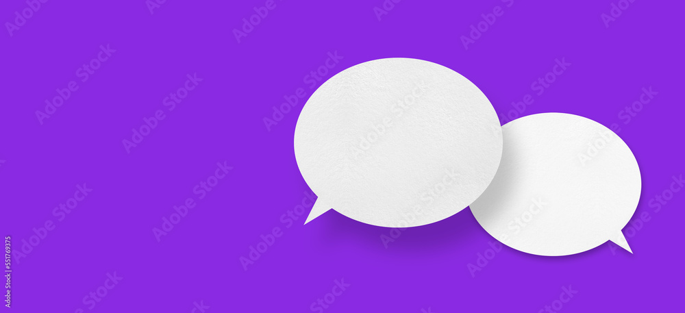 White paper in the shape of speech bubbles against a purple background. communication bubbles White paper in the shape of speech bubbles against a purple background. communication bubbles