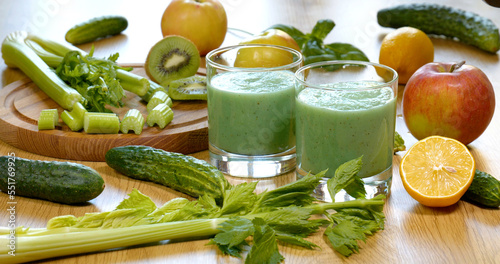 Organic freshly squeezed green vegetable and fruit smoothie in a glass