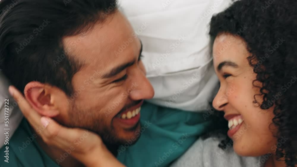 Happy, love and couple relaxing in bed together bonding, resting and laughing in their home. Happiness, smile and young man and woman having a conversation in the morning in hotel, apartment or house Happy, love and couple relaxing in bed together bonding, resting and laughing in their home. Happiness, smile and young man and woman having a conversation in the morning in hotel, apartment or house