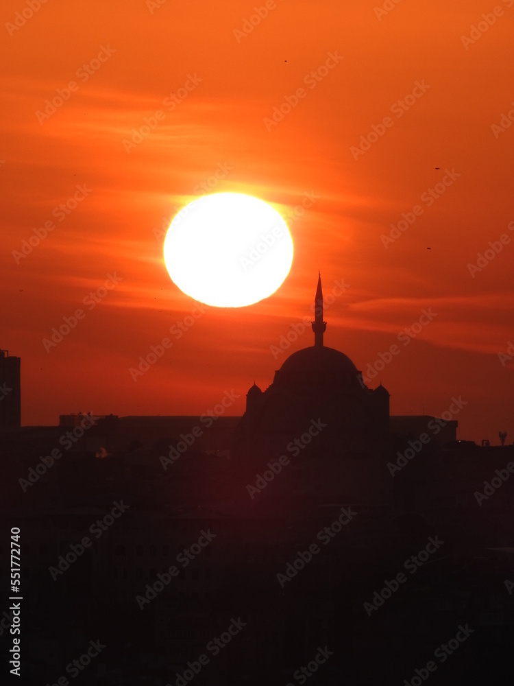 Sunset view and mosque, orange sky, with space