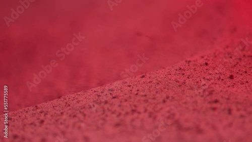 Red sand blowing slowly in the wond. photo