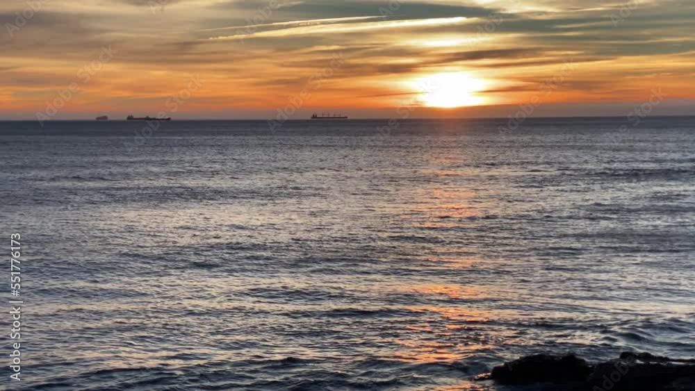 wide view of dramatic sunset with orange sky in a sunny day. wide view of dramatic sunset with orange sky in a sunny day.