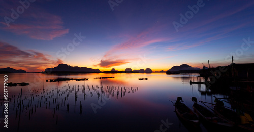 Landscape Long exposure of majestic clouds in the sky sunset or sunrise over sea with reflection in the tropical sea surface  Beautiful seascape scenery  Amazing light of nature sunset or sunrise