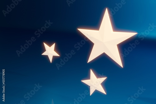 Light emitting three dimensional stars on blue metallic background.