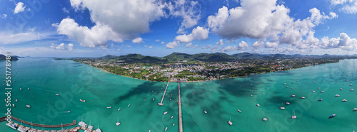 Fototapeta Naklejka Na Ścianę i Meble -  Panorama Chalong pier with sailboats and other boats at the sea,Beautiful image for travel and tour website design,Amazing phuket island view from drone panoramic landscape,Summer day time