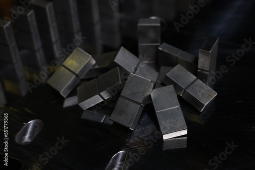 Metal dominoes on top of mold plate.