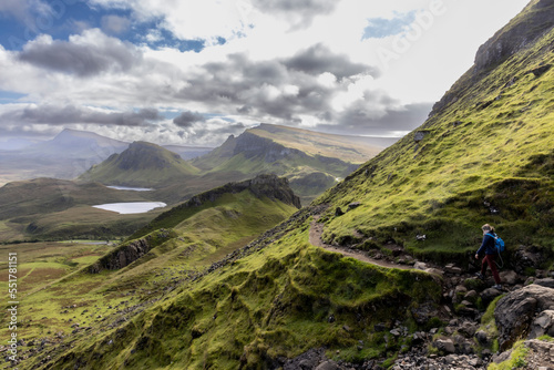 Obraz na płótnie Woman hiking on Quiraing.It is a geological formation on the Scottish Isle of Skye and a hiker's paradise w salonie