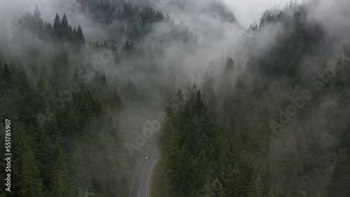 Bicaz pass mountain road high up in the Carpathian Mountains in Romania on a foggy autumn day photo