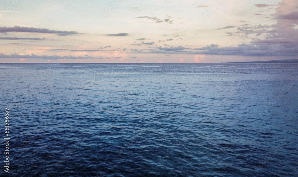 Obraz premium sunset and ocean open ocean vastness tropical water intonesia