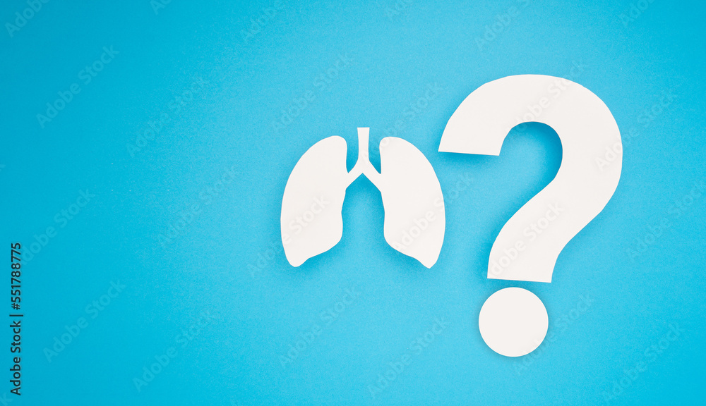 A lungs symbol and question mark symbol are on a blue background