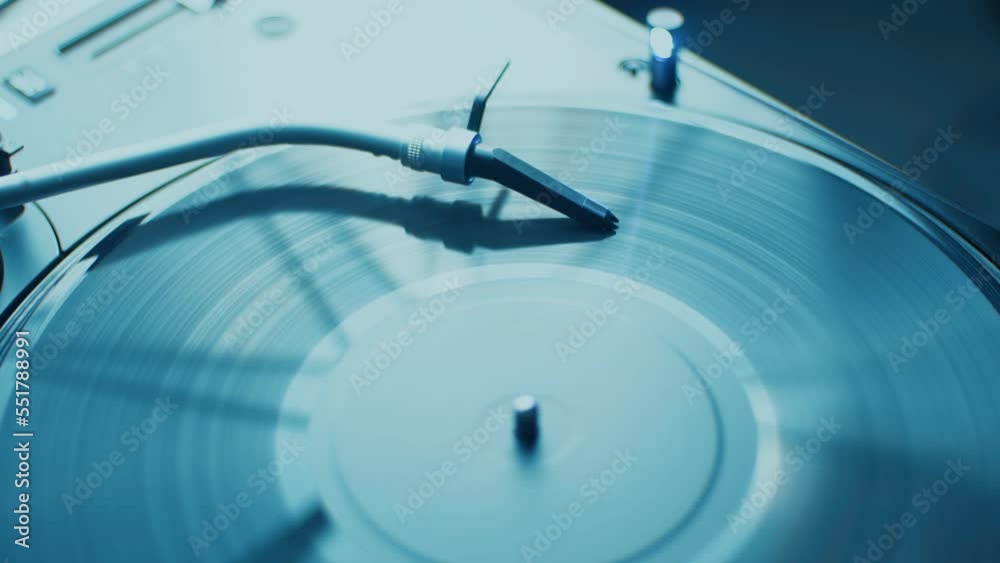 Turntables tone arm with spherical needle on vinyl disc. Dj turn table record player device plays music Turntables tone arm with spherical needle on vinyl disc. Dj turn table record player device plays music