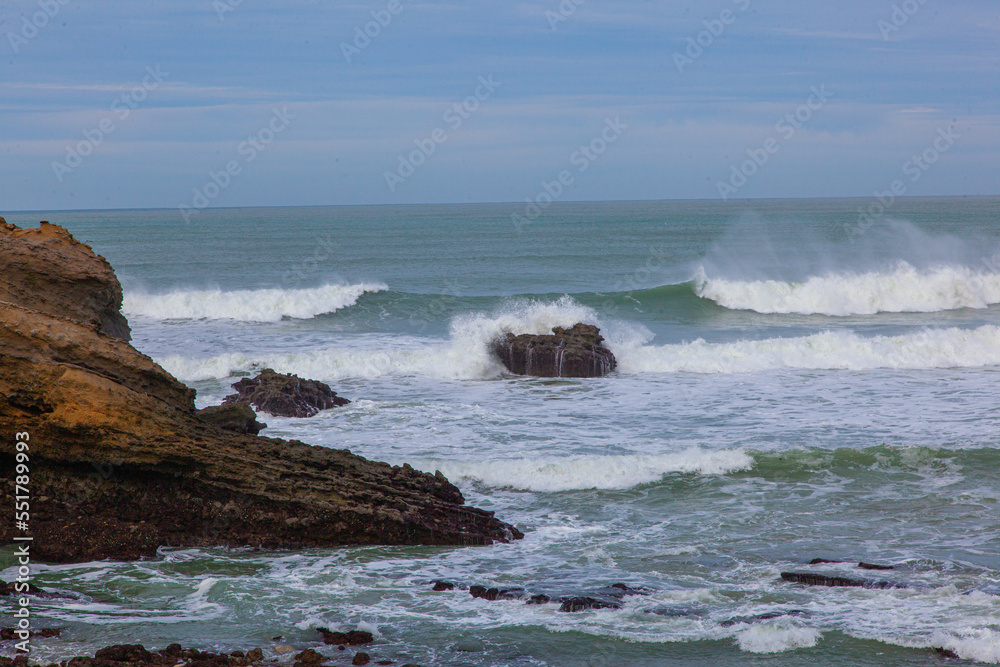 waves breaking on the rocks