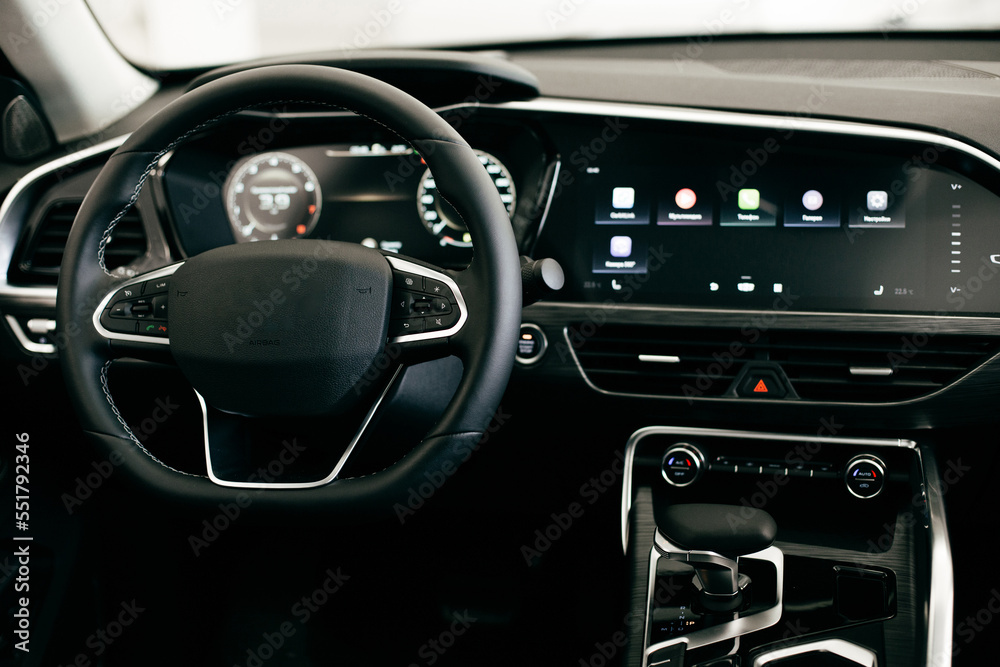 Dark luxury car Interior - steering wheel, shift lever and dashboard. Car interior luxury Dark luxury car Interior - steering wheel, shift lever and dashboard. Car interior luxury