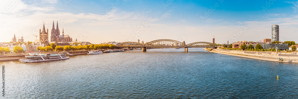 Great Panoramic view of the city of Koln, the Rhine River, bridges and various ferries and ships at the pier.