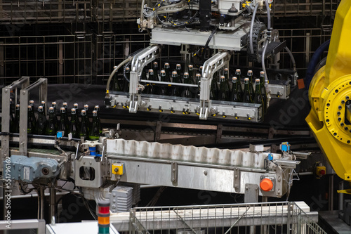 Production of cremant sparkling wine in Burgundy  France. Automatically powered bottling lines on factory.
