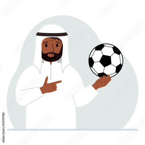 A man holds a soccer ball in his hand. The concept of a player, fan or coach.