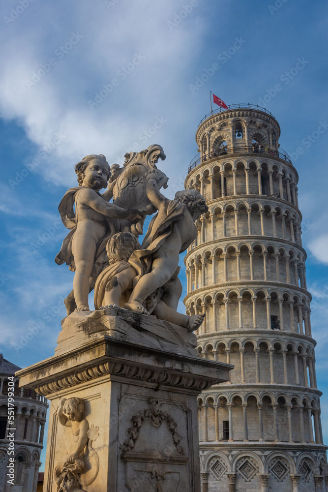 Classical statue in front of the Leaning Tower of Pisa,  Italy