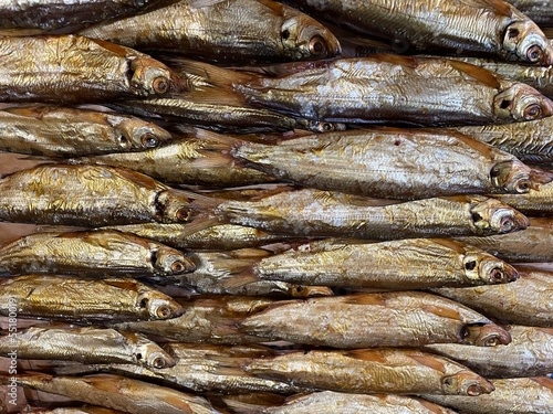 large vertical photo. northern river fish. vendace. fish laid out in a straight line on the table close-up. healthy omega 3 fats. © Екатерина Тимошенко