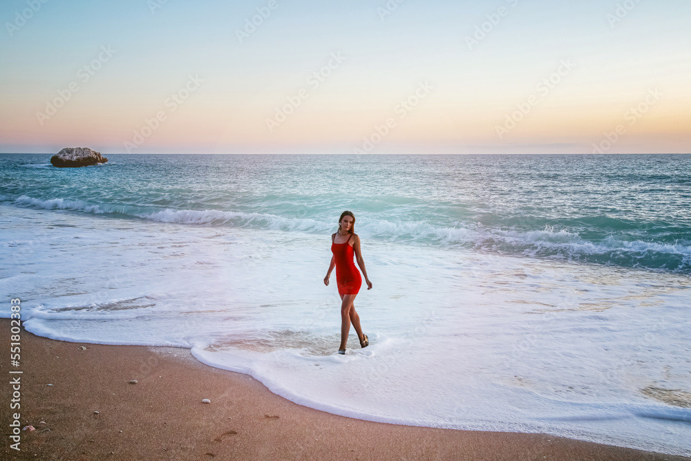 A woman as Aphrodite emerging from the sea at Aphrodite Beach, Cyprus
