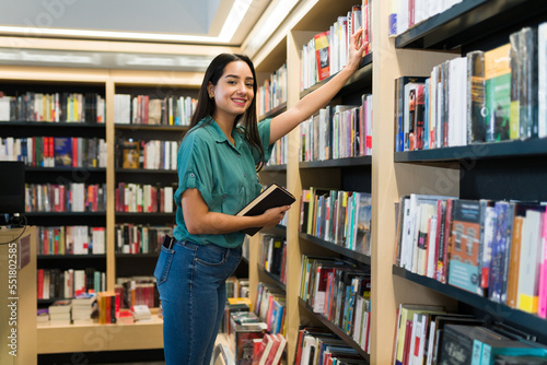 Portrait of a young woman shopping at the book shop