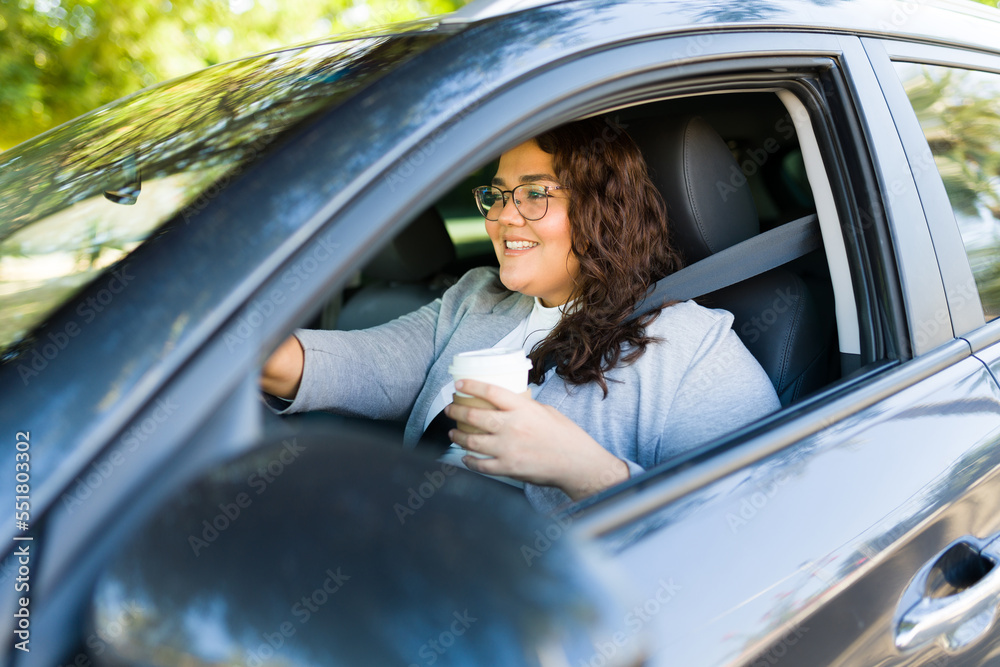 Excited fat woman driving with a coffee Excited fat woman driving with a coffee