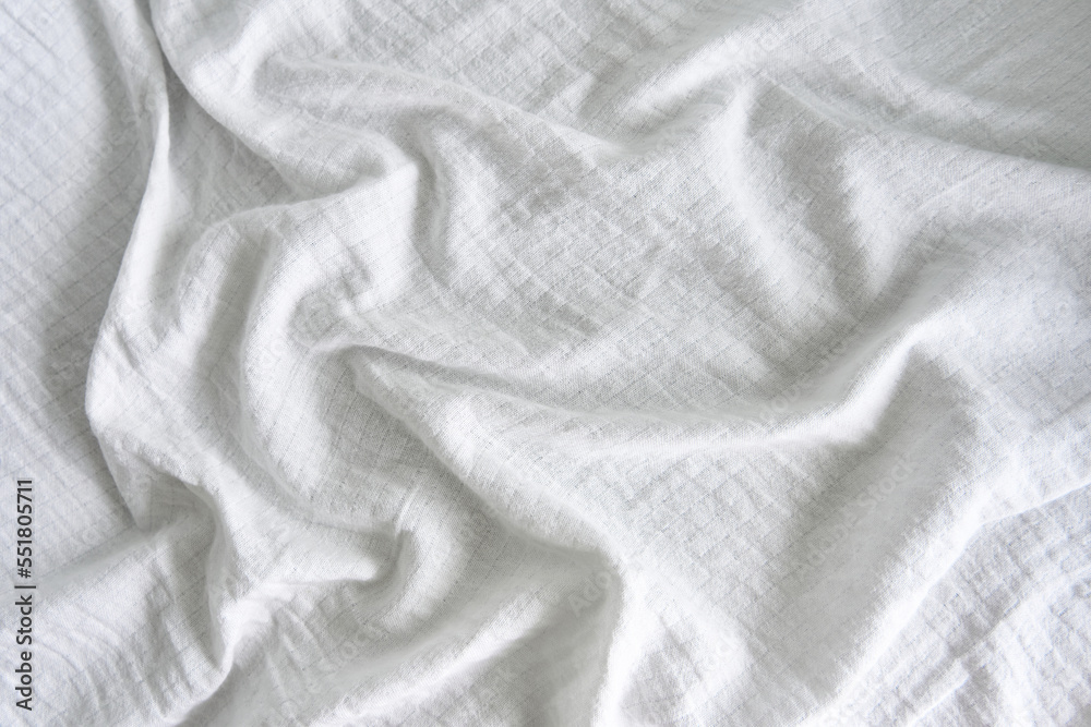 Fototapeta premium The texture of the wrinkled white fabric