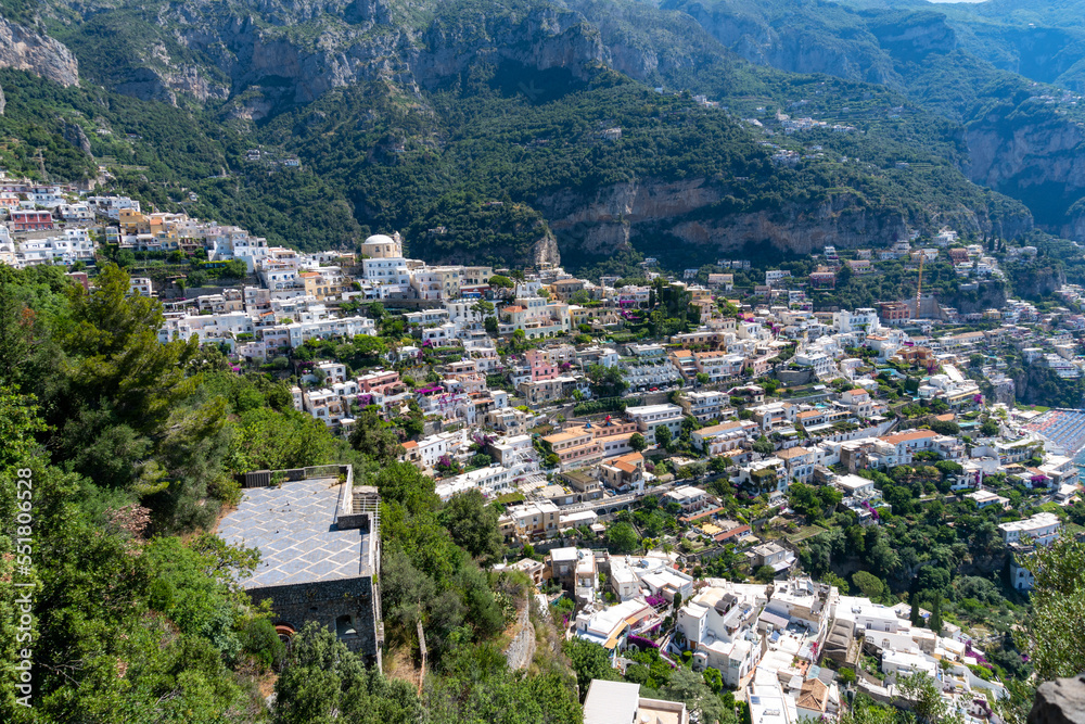Positano seen from the viewpoint up on the mountain on a sunny day.