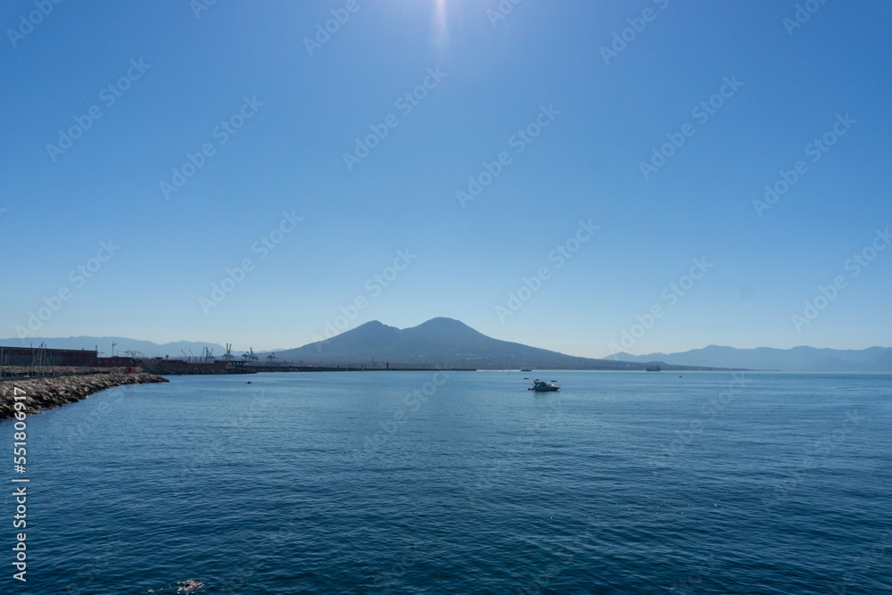 View of the volcano Vesuvius from in Castle of the Egg in Naples, on a sunny day. View of the volcano Vesuvius from in Castle of the Egg in Naples, on a sunny day.