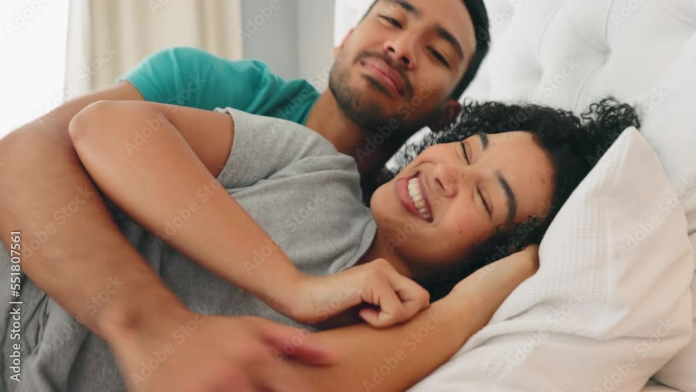 Couple, talking and happy cuddle in the bed to relax and rest while at home to sleep. Bedroom, man and woman or happy couple snuggling with romance in a loving, caring cosy relationship Couple, talking and happy cuddle in the bed to relax and rest while at home to sleep. Bedroom, man and woman or happy couple snuggling with romance in a loving, caring cosy relationship