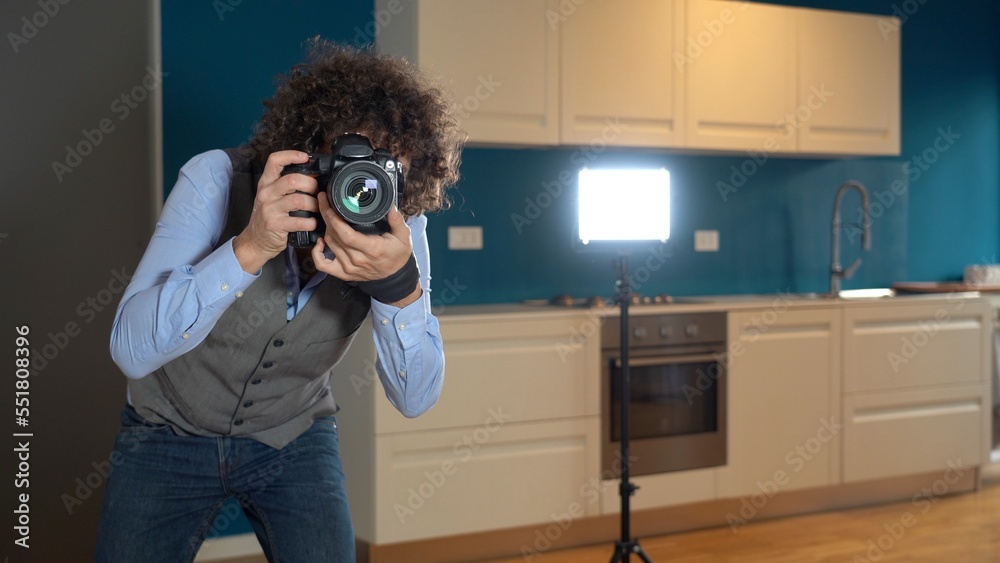Milan January 2022 Photographer real estate - videos and photos of interiors of houses for sale - home staging in the kitchen blue wall - professional photographic shooting indoor at home
