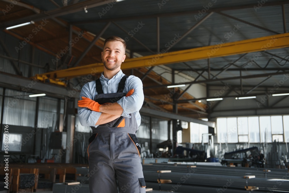 Portrait of factory worker. Young handsome factory worker.