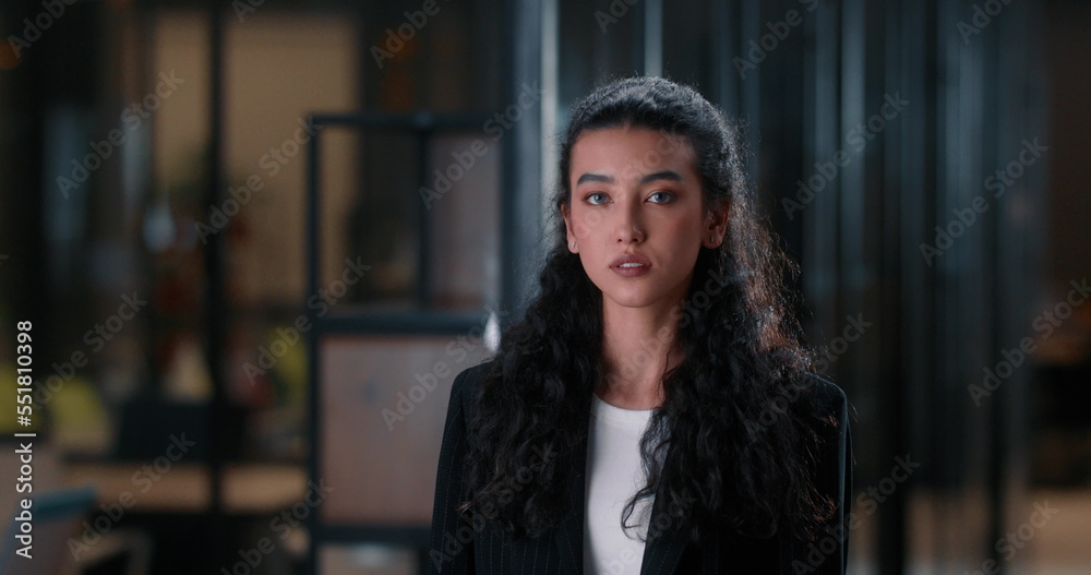 Broker woman works in the office with stock shares. A successful broker woman offers her services for profitable financing. Cinematic shot of bank clerk in the office holding a tablet with sales data. Broker woman works in the office with stock shares. A successful broker woman offers her services for profitable financing. Cinematic shot of bank clerk in the office holding a tablet with sales data.
