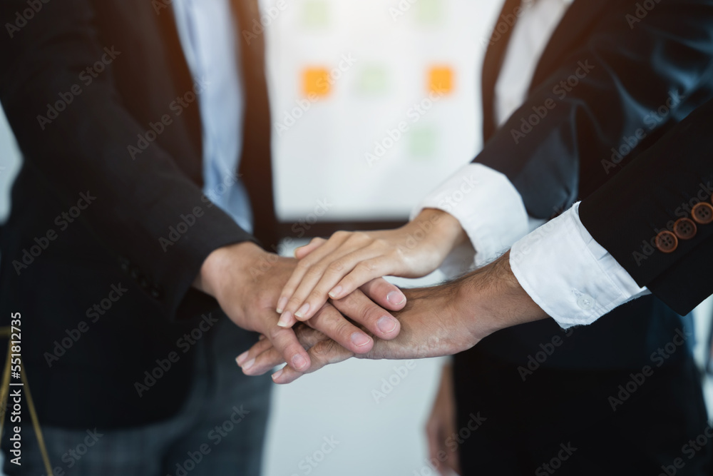 Business team shake hands after agreeing to start a new project successfully.