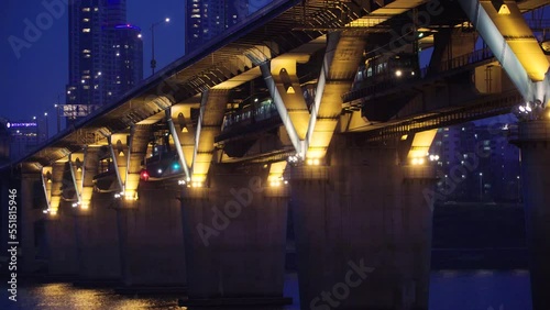 Night view taken at night, Seoul's subway passing through a bridge over the Han River