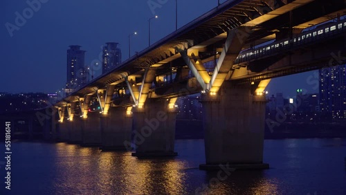 Night view taken at night, Seoul's subway passing through a bridge over the Han River