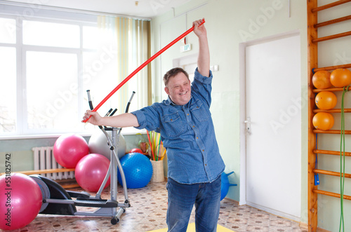 A man with Down syndrome does sports 