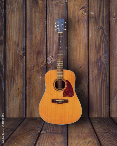 Acoustic Guitar in wooden vintage room.