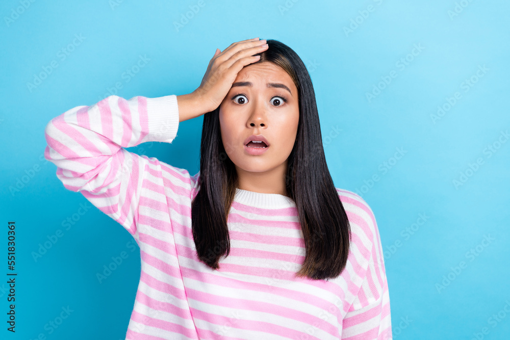 Photo of young nervous stressed korean lady working manager touch forehead scared forgot about deadline trouble isolated on blue color background Photo of young nervous stressed korean lady working manager touch forehead scared forgot about deadline trouble isolated on blue color background